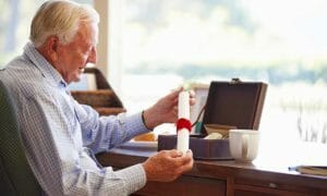 elderly man holding will | cwa estate planning